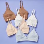 The Yellowberry commitment to excellence in the Lily Bra is evident in every stitch, every detail, and every choice of material of every Yellowberry product. Group images of Lilly bras on lavender background.