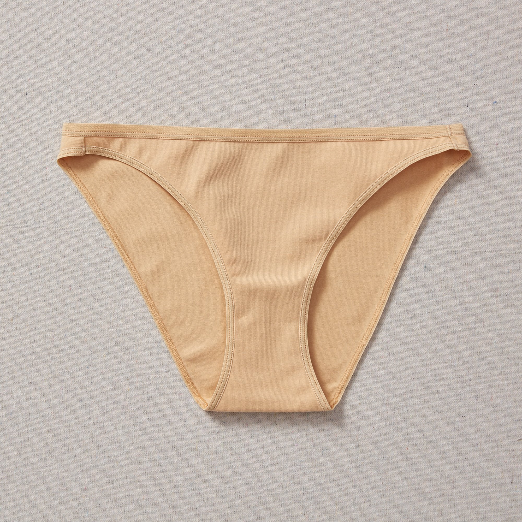 Yellowberry Petal Underwear are the epitome of comfort, style, and quality for your daughter's everyday wear. Crafted with meticulous attention to detail, these undies offer an impeccable fit and superior construction that will keep her feeling confident and comfortable all day long. Beige Doe front on natural linen