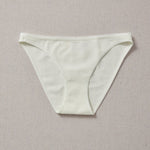 Yellowberry Petal Underwear are the epitome of comfort, style, and quality for your daughter's everyday wear. Crafted with meticulous attention to detail, these undies offer an impeccable fit and superior construction that will keep her feeling confident and comfortable all day long. Beach glass front on natural linen