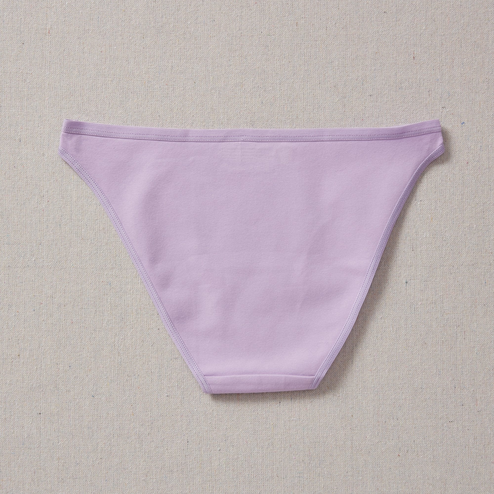 Yellowberry Petal Underwear are the epitome of comfort, style, and quality for your daughter's everyday wear. Crafted with meticulous attention to detail, these undies offer an impeccable fit and superior construction that will keep her feeling confident and comfortable all day long. Huckleberry Lavender back on natural linen