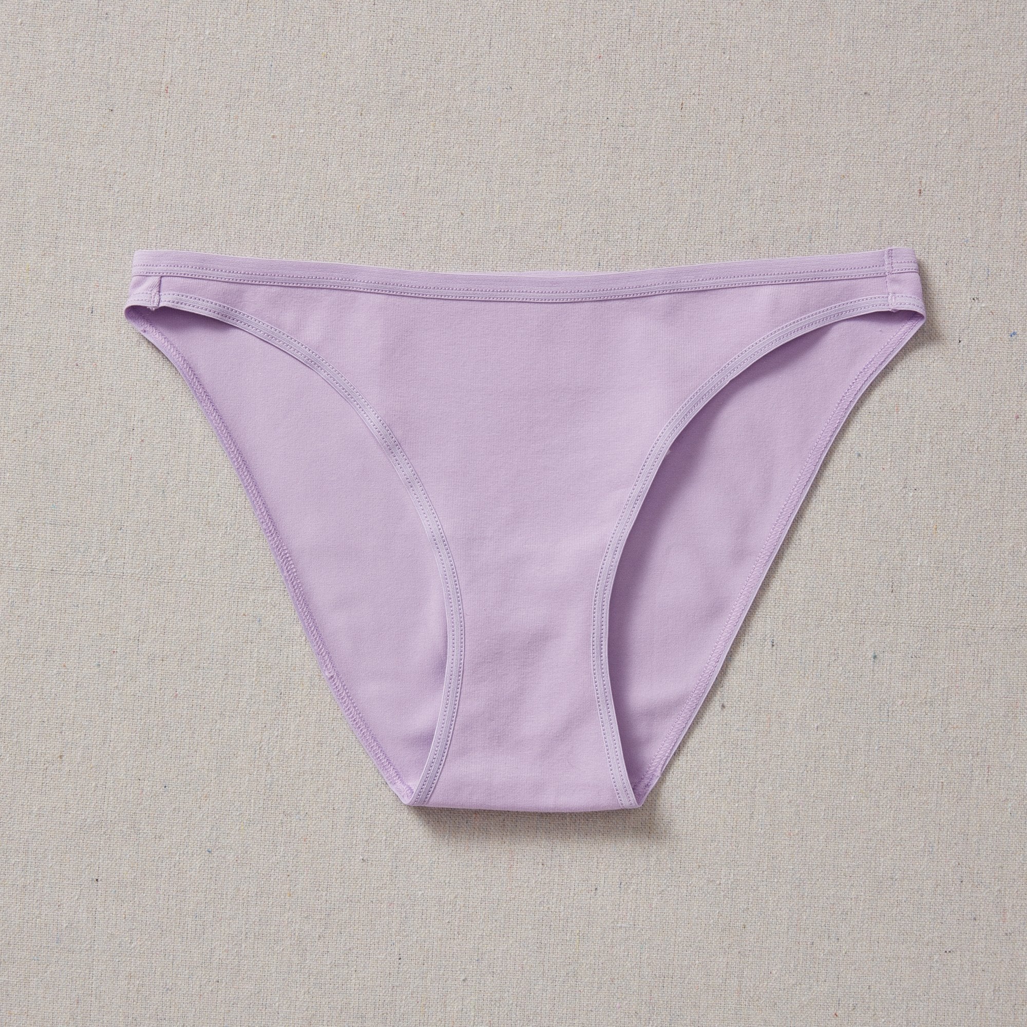 Yellowberry Petal Underwear are the epitome of comfort, style, and quality for your daughter's everyday wear. Crafted with meticulous attention to detail, these undies offer an impeccable fit and superior construction that will keep her feeling confident and comfortable all day long. Huckleberry Lavender front on natural linen