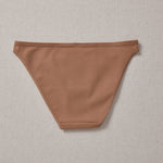 Yellowberry Petal Underwear are the epitome of comfort, style, and quality for your daughter's everyday wear. Crafted with meticulous attention to detail, these undies offer an impeccable fit and superior construction that will keep her feeling confident and comfortable all day long. Mocha brown back on natural linen