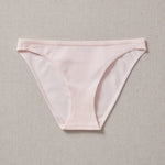Yellowberry Petal Underwear are the epitome of comfort, style, and quality for your daughter's everyday wear. Crafted with meticulous attention to detail, these undies offer an impeccable fit and superior construction that will keep her feeling confident and comfortable all day long. Bubblegum pink front on natural linen