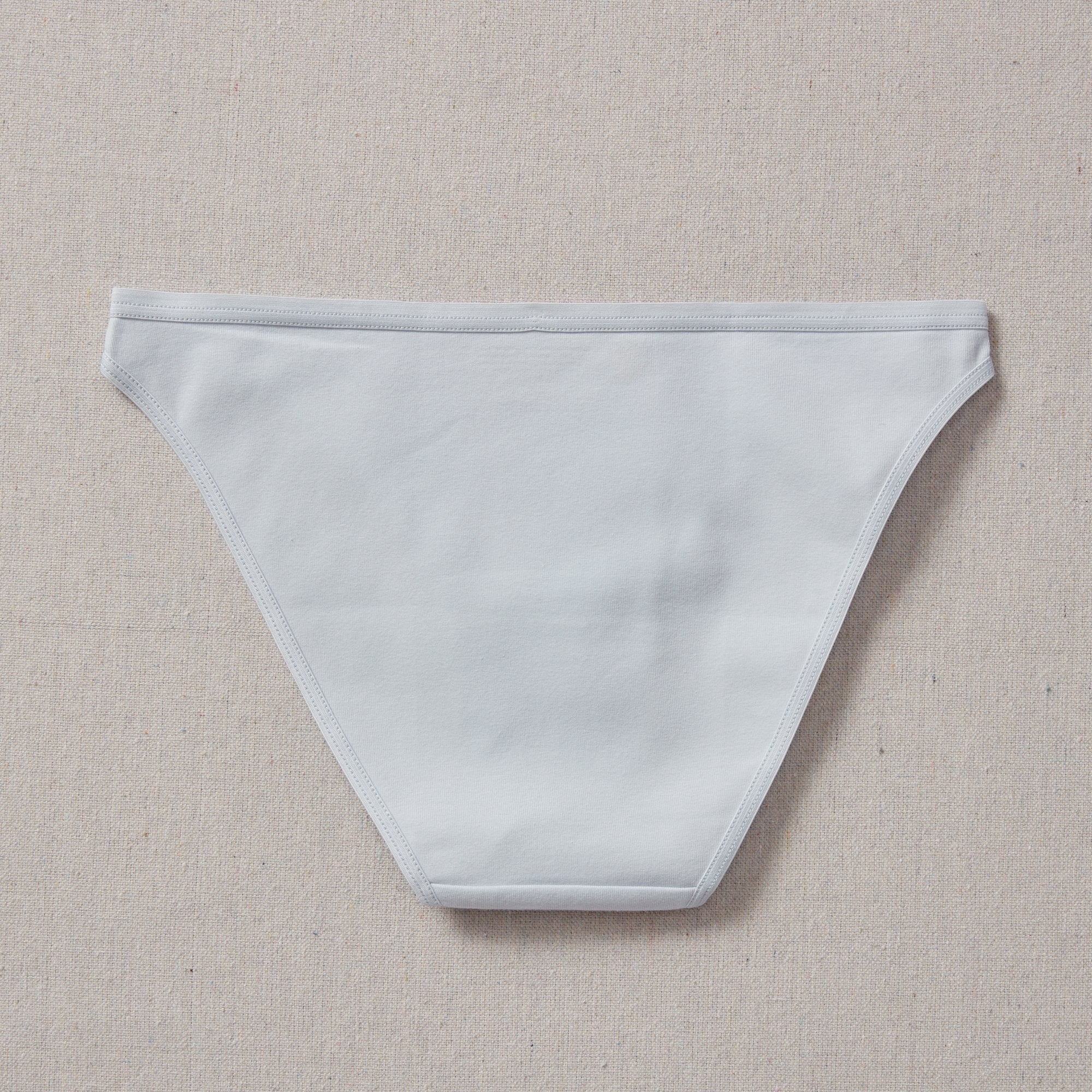 Yellowberry Petal Underwear are the epitome of comfort, style, and quality for your daughter's everyday wear. Crafted with meticulous attention to detail, these undies offer an impeccable fit and superior construction that will keep her feeling confident and comfortable all day long. Raindrop Light Blue back on natural linen