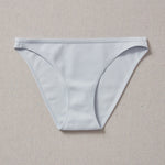 Yellowberry Petal Underwear are the epitome of comfort, style, and quality for your daughter's everyday wear. Crafted with meticulous attention to detail, these undies offer an impeccable fit and superior construction that will keep her feeling confident and comfortable all day long. Raindrop Light Blue front on natural linen