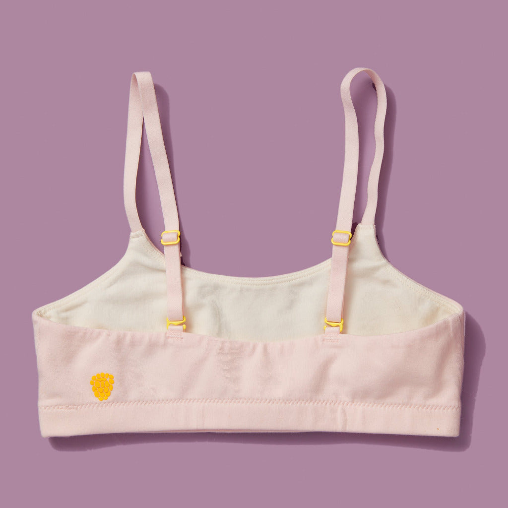 High-quality, all-natural, antimicrobial  Yellowberry Pipit First Training Bra. Super soft, all-natural cotton beginner bra. Supportive everyday bra with no underwires. High-quality, double-layered fabric. No padding. Designed with sensitive skin. Machine wash, and dry. Best teenager bra for active girls, tweens, and teens. Female founded, female owned brand