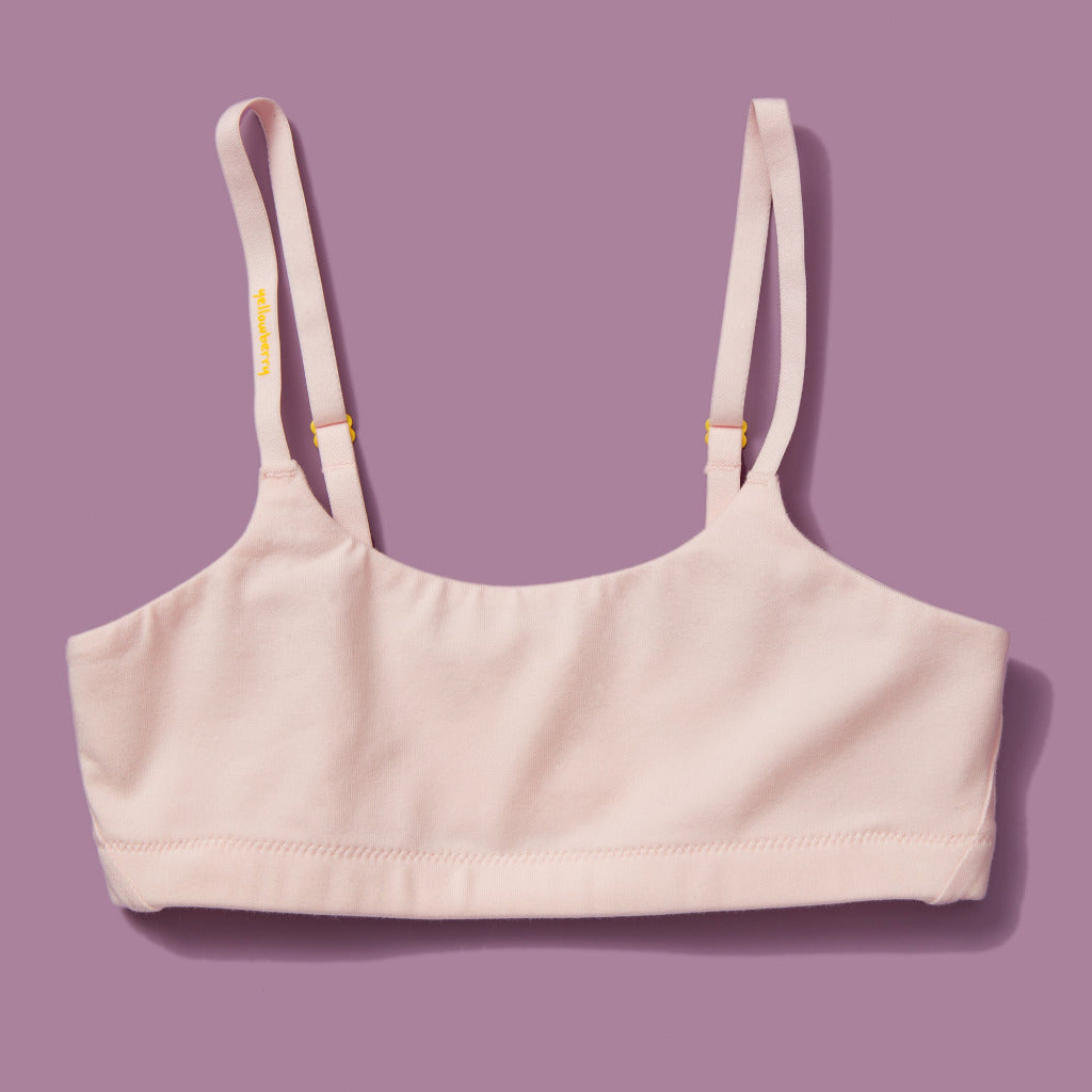 Yellowberry Pipit First Training Bra. Super soft, all-natural cotton beginner bra. Supportive everyday bra with no underwires. High-quality, double-layered fabric. No padding. Designed with sensitive skin. Machine wash, and dry. Best teenager bra for active girls, tweens, and teens. The original female founded, female owned brand based in Jackson Hole.