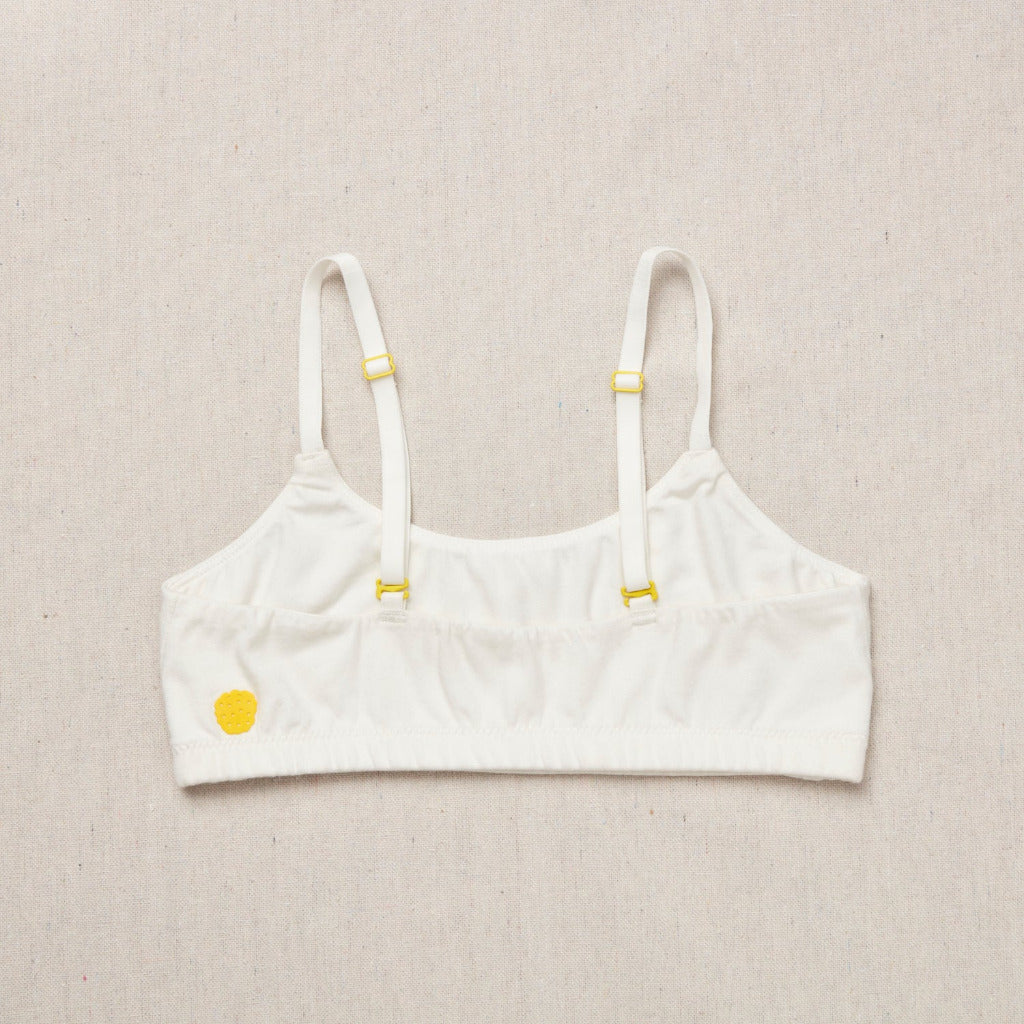 High-quality, all-natural, antimicrobial  Yellowberry Pipit First Training Bra. Super soft, all-natural cotton beginner bra. Supportive everyday bra with no underwires. High-quality, double-layered fabric. No padding. Designed with sensitive skin. Machine wash, and dry. Best teenager bra for active girls, tweens, and teens. Based in Jackson Hole.