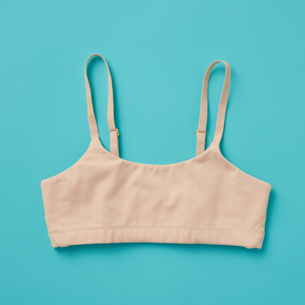 High-quality, all-natural, antimicrobial  Yellowberry Pipit First Training Bra. Super soft, all-natural cotton beginner bra. Supportive everyday bra with no underwires. High-quality, double-layered fabric. No padding. Designed for girls and daughters with sensitive skin. Machine wash, and dry. Best teenager bra for active girls, tweens, and teens.