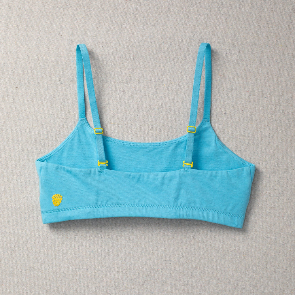 Detail laydown back image of high-quality, all-natural, antimicrobial  Yellowberry Pipit First Training Bra. Super soft, all-natural cotton bra for girls. Best first bra. Made with high-quality, double-layered fabric. Offers full coverage for developing girls. Designed for girls and daughters with sensitive skin. Machine wash, and dry. Best training bra for active girls, tweens, and teens.