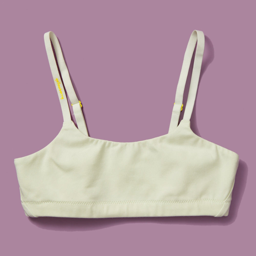 High-quality, all-natural, antimicrobial  Yellowberry Pipit First Training Bra. Super soft, all-natural cotton beginner bra. Supportive everyday bra with no underwires. High-quality, double-layered fabric. No padding. Designed with sensitive skin. Machine wash, and dry. Best teenager bra for active girls, tweens, and teens. The original female founded brand based in Jackson Hole.