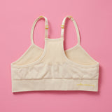 The Ultimate Seamless Racerback Girls Bra - Your Daughter's First Choice for Everyday Comfort! Are you searching for the perfect seamless bra for your growing girl? Look no further! Our girls' seamless racerback bra is meticulously designed with superior features to ensure unbeatable comfort and support, making it the ideal choice for her first bras and everyday wear. Doe Back image on pink background.