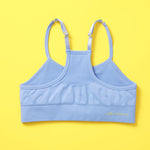The Ultimate Seamless Racerback Girls Bra - Your Daughter's First Choice for Everyday Comfort! Are you searching for the perfect seamless bra for your growing girl? Look no further! Our girls' seamless racerback bra is meticulously designed with superior features to ensure unbeatable comfort and support, making it the ideal choice for her first bras and everyday wear. Ocean Back image on yellow background.