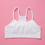 The Ultimate Seamless Racerback Girls Bra - Your Daughter's First Choice for Everyday Comfort! Are you searching for the perfect seamless bra for your growing girl? Look no further! Our girls' seamless racerback bra is meticulously designed with superior features to ensure unbeatable comfort and support, making it the ideal choice for her first bras and everyday wear. Snowflake front image on pink background.