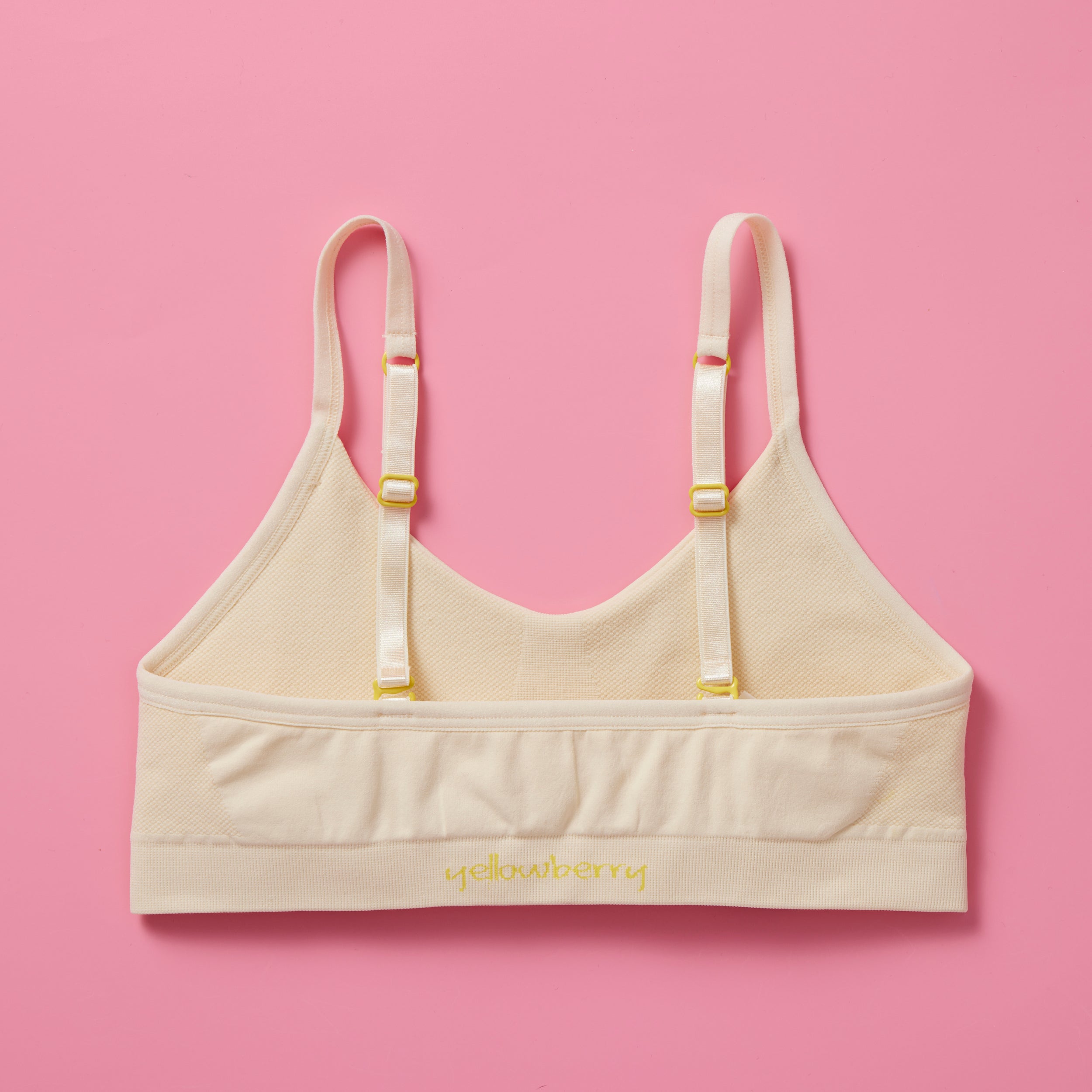 Our Tulip Bra is updated with softer and slightly thicker fabric, doe (beige) back. We added gentle ruching to allow room and support for development and growing girls. The Tulip bra is a fantastic option for all girls in search of an everyday, blissfully soft and comfortable addition to their top drawers.