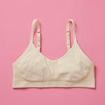 Our Tulip Bra is updated with softer and slightly thicker fabric, doe (beige) front. We added gentle ruching to allow room and support for development and growing girls. The Tulip bra is a fantastic option for all girls in search of an everyday, blissfully soft and comfortable addition to their top drawers.