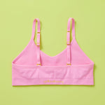 Our Tulip Bra is updated with softer and slightly thicker fabric, peony (pink) back. We added gentle ruching to allow room and support for development and growing girls. The Tulip bra is a fantastic option for all girls in search of an everyday, blissfully soft and comfortable addition to their top drawers.