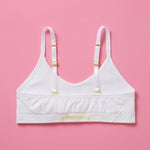 Our Tulip Bra is updated with softer and slightly thicker fabric, snowflake (white) back. We added gentle ruching to allow room and support for development and growing girls. The Tulip bra is a fantastic option for all girls in search of an everyday, blissfully soft and comfortable addition to their top drawers.
