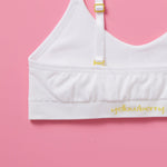 Our Tulip Bra is updated with softer and slightly thicker fabric, snowflake (white) back detail. We added gentle ruching to allow room and support for development and growing girls. The Tulip bra is a fantastic option for all girls in search of an everyday, blissfully soft and comfortable addition to their top drawers.