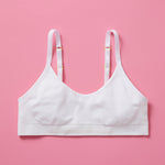 Our Tulip Bra is updated with softer and slightly thicker fabric, snowflake (white) front. We added gentle ruching to allow room and support for development and growing girls. The Tulip bra is a fantastic option for all girls in search of an everyday, blissfully soft and comfortable addition to their top drawers.