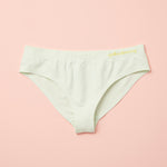 Yellowberry Twistr Seamless Underwear in Beach Glass (light green color) on a pink background. These underwear are true seamless, high quality girls underwear and made with super soft fabrics. Girl and mom approved!