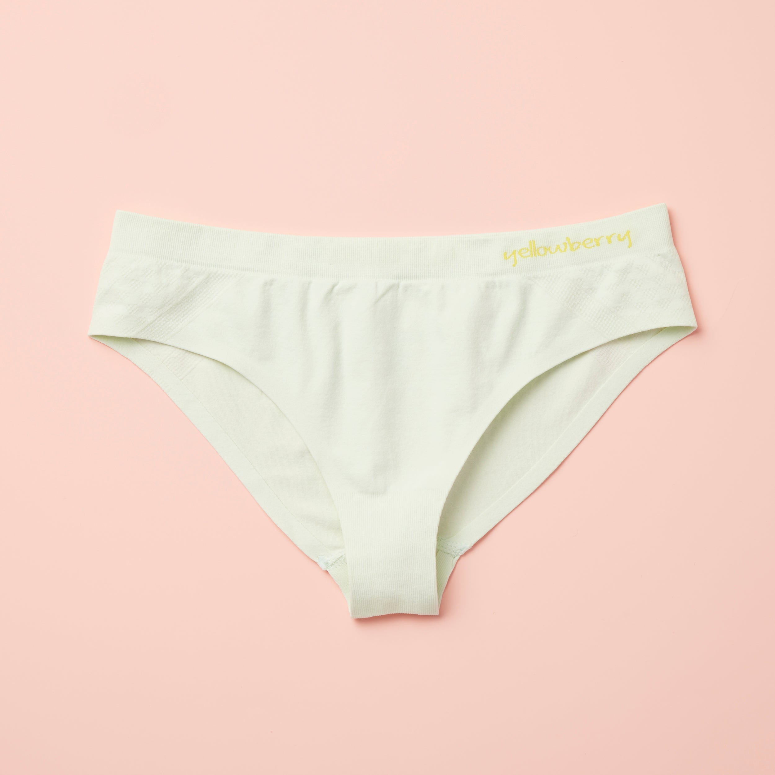 Yellowberry Twistr Seamless Underwear in Beach Glass (light green color) on a pink background. These underwear are true seamless, high quality girls underwear and made with super soft fabrics. Girl and mom approved!