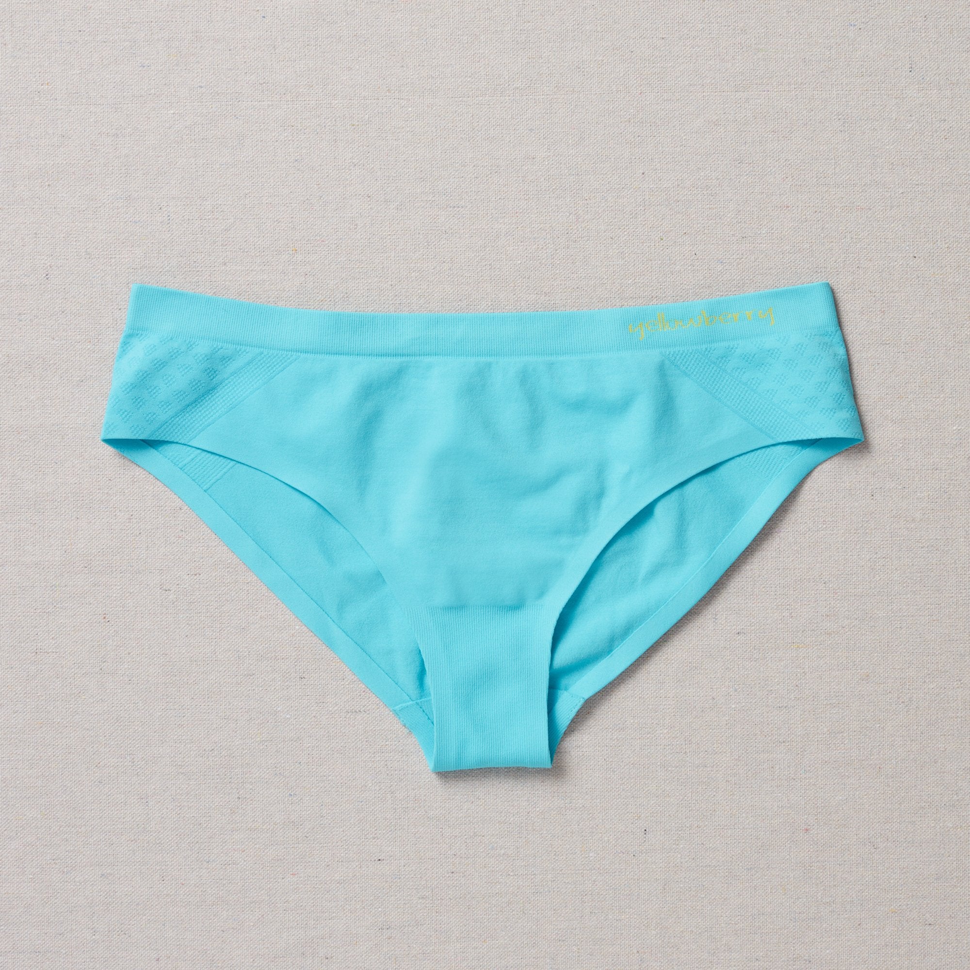 Yellowberry Twistr Seamless Underwear in Fremont (aqua blue color) on a neutral background. These underwear are true seamless, high quality girls underwear and made with super soft fabrics. Girl and mom approved!