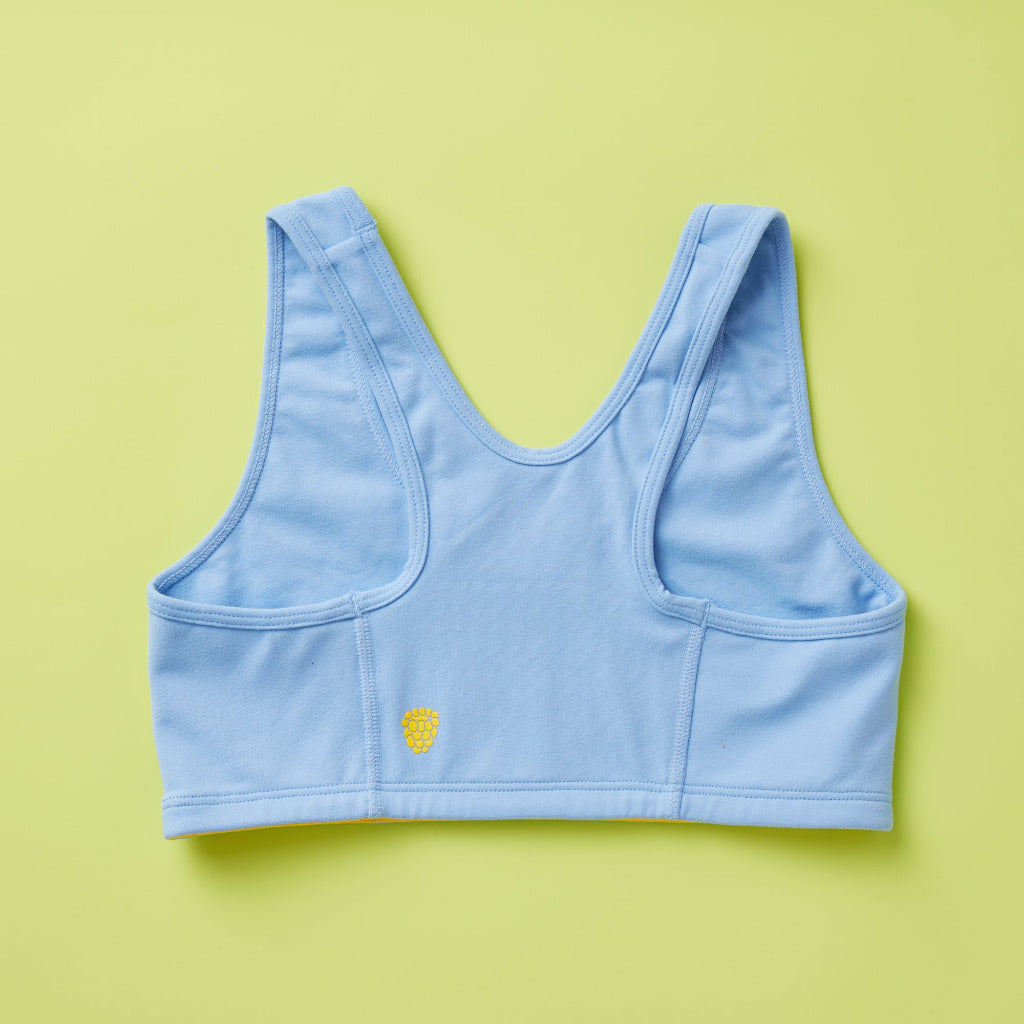 Back image of Half Moon Bra in light blue. Our original, first-ever sports bra. Now as a newly redesigned and improved high-impact style. Featuring a wider width racerback and buttery soft fabric, this is the ideal choice for running, jumping, training, and more. This style is built for high-impact activity, offering full support no matter what. Run, hike, bike, jump, skip, leap, and then maybe fall down only to get right back up.