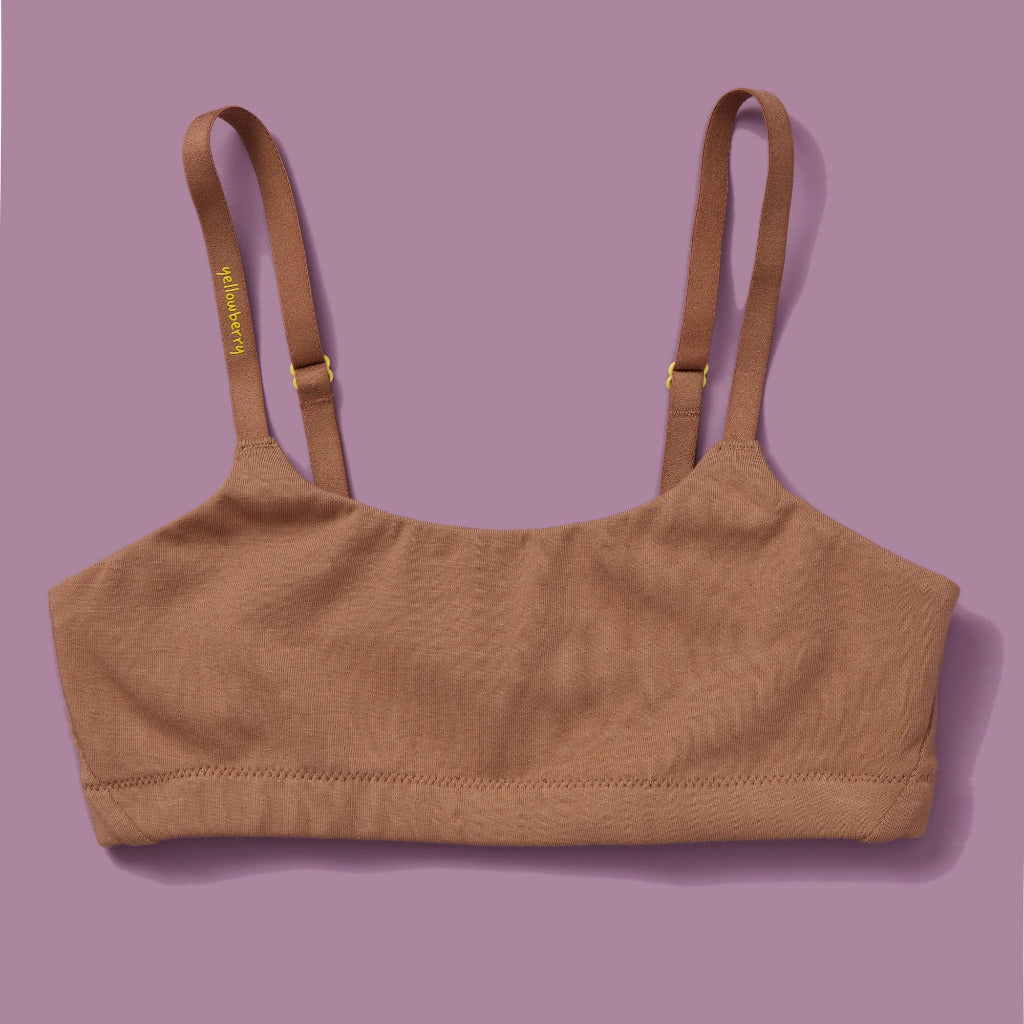 High-quality, all-natural, antimicrobial  Yellowberry Pipit First Training Bra. Super soft, all-natural cotton beginner bra. Supportive everyday bra with no underwires. High-quality, double-layered fabric. No padding. Designed with sensitive skin. Machine wash, and dry. Best teenager bra for active girls, tweens, and teens. The original female founded brand based in Jackson Hole.