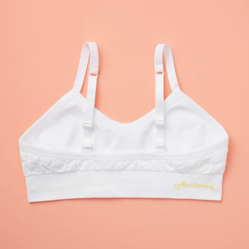 Our Seamless Poppy Bra is sewn with extra soft, double layered, antimicrobial fabric. It offers great support as a training bra as well as for developing girls, teens, and tweens. Straps are convertible, straps are adjustable, and its quick-dry fabric is perfect for girls with skin sensitivities. Perfect everyday bra.