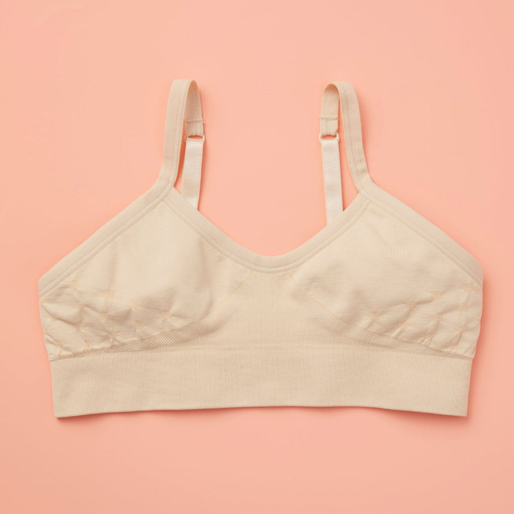 Our Seamless Poppy Bra is sewn with extra soft, double layered, antimicrobial fabric. It offers great support as a training bra as well as for developing girls, teens, and tweens. Straps are convertible, straps are adjustable, and its quick-dry fabric is perfect for girls with skin sensitivities. Perfect everyday bra.