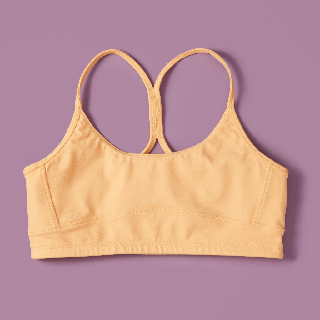 Yellowberry Tink Hybrid Sports Bra. Like two bras in one! Made with high quality, double-layered, antimicrobial, moisture wicking fabric. Made for all high impact and light activity (running, soccer, gymnastics)