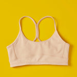 Front close detail image of Yellowberry Tink Hybrid Sports Bra in beige. Like two bras in one! Made with high-quality, double-layered, antimicrobial, moisture-wicking fabric. 