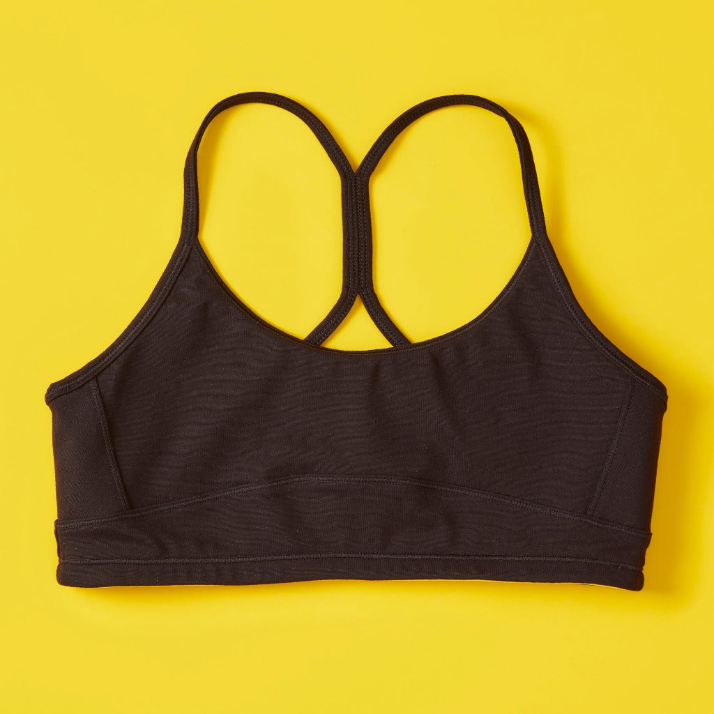 Our beloved Tink bra is our first-ever hybrid sports bra, and one of our most recognizable, signature styles. This bra was designed for girls to wear all day long at school, and not miss a beat for practice in the afternoon. No need to change, that&#39;s the beauty of the hybrid bras! It&#39;s like a two-in-one: everyday bra, AND full-support sports bra. Designed with an innovative open back, it&#39;s our newer take on the racerback style